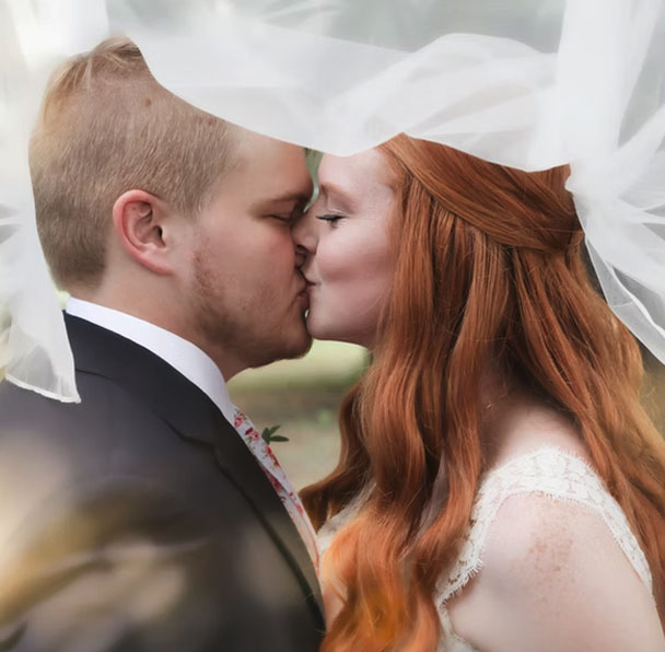 about-photography-credit-img Photo of a man and woman kissing on their wedding day at the altar.