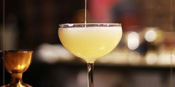 dining-header-img-mobile Photo of a margarita being poured at a bar.