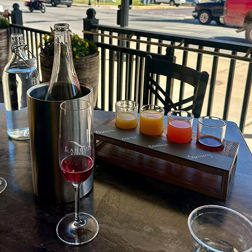 Photo of a wine tasting flight outside the Landon Winery